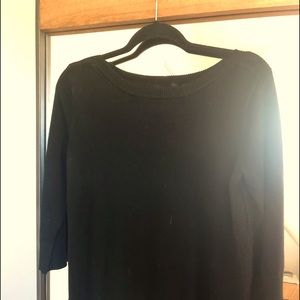 Comfy black sweater with notched side hem detail